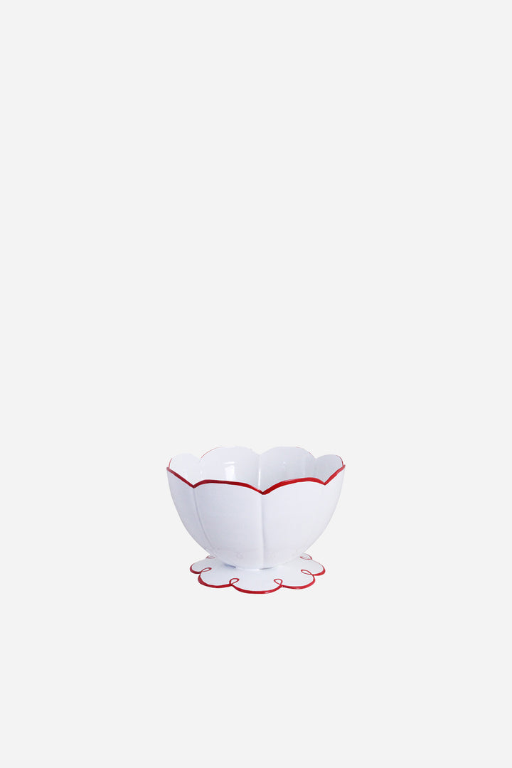 White bowl with red rim and base on a white background
