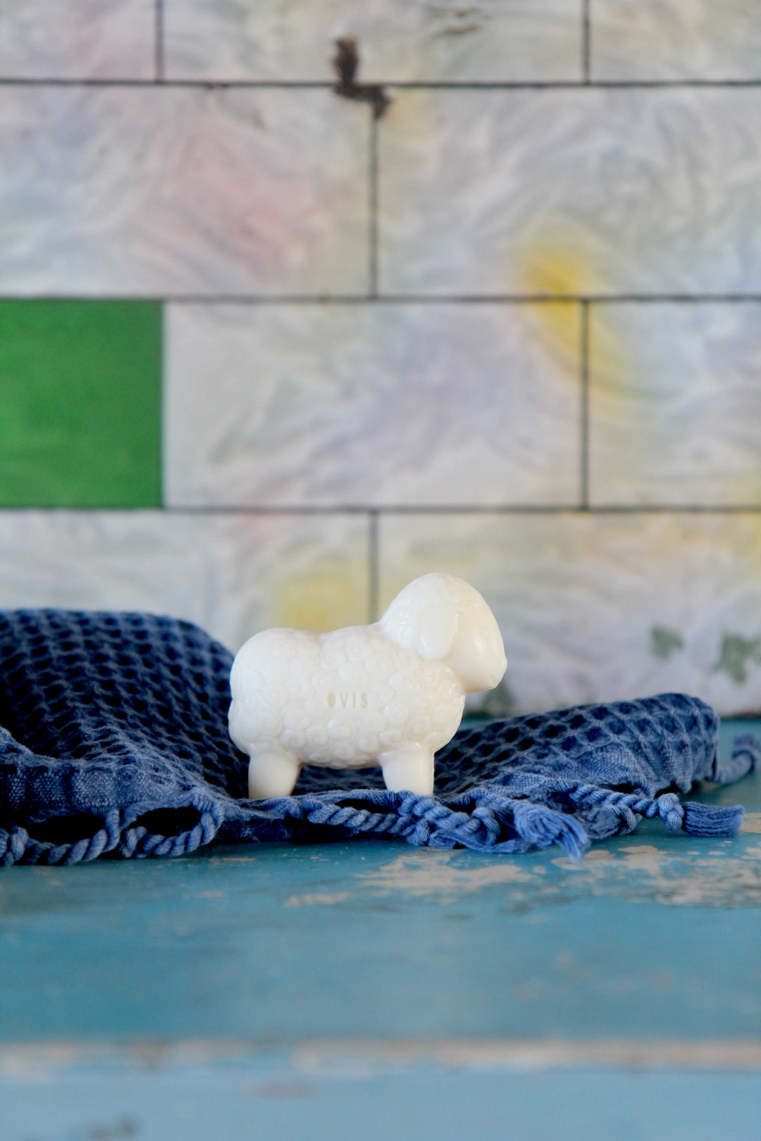 sheep shaped soap made with sheeps milk and blue waffle towel