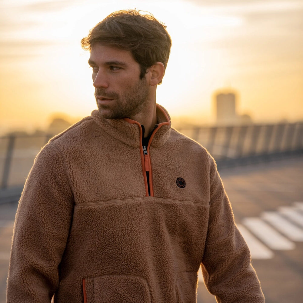 mens cosy sherpa half zip fleece in tan colour with contrasting orange trim from Billy Belt lifestyle shot