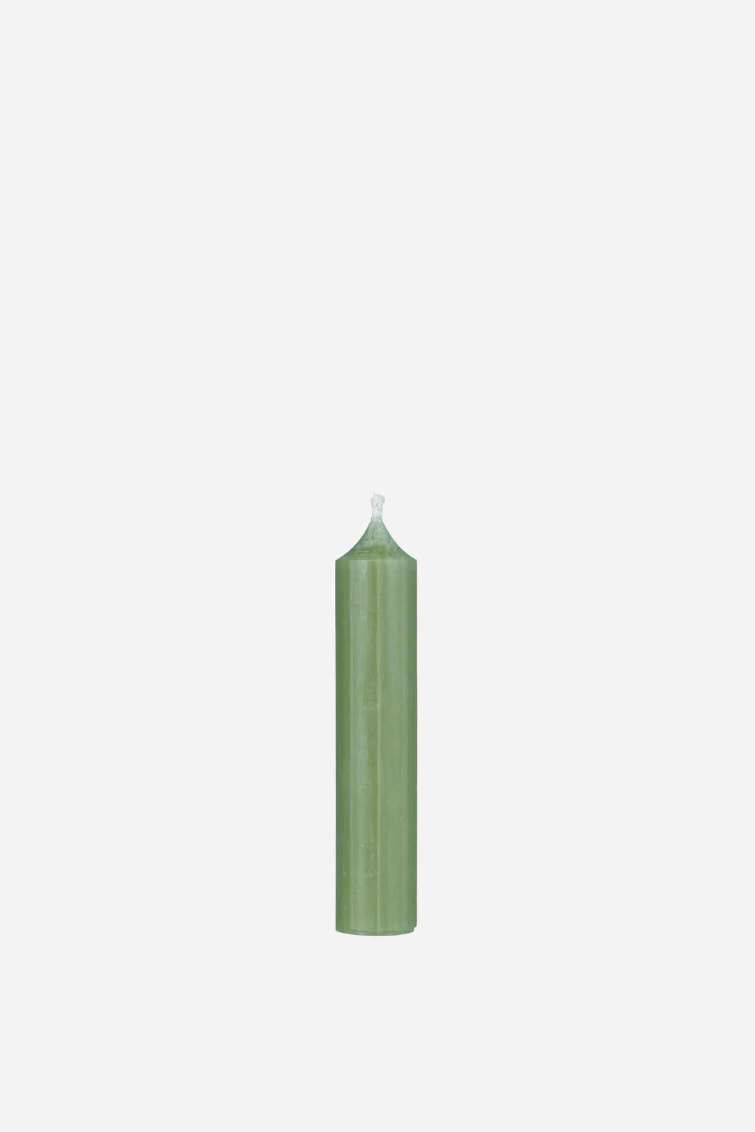 Green candle on a white background
