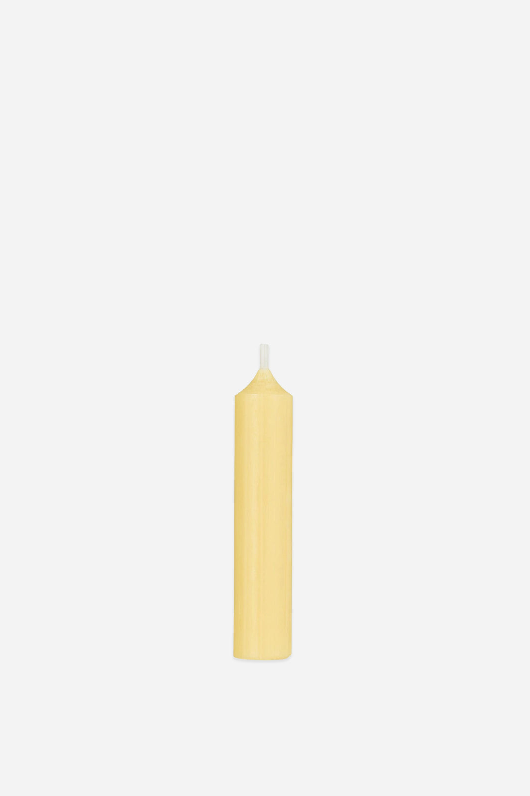 Yellow candle on a white background