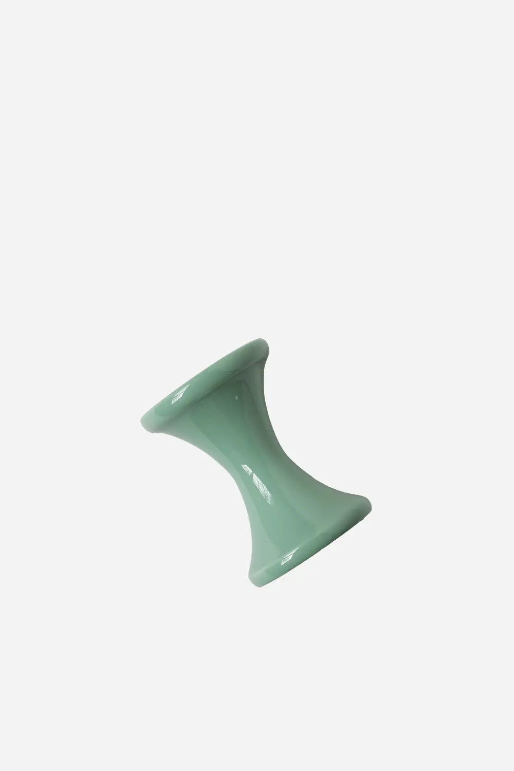 Green ceramic vase on a white background