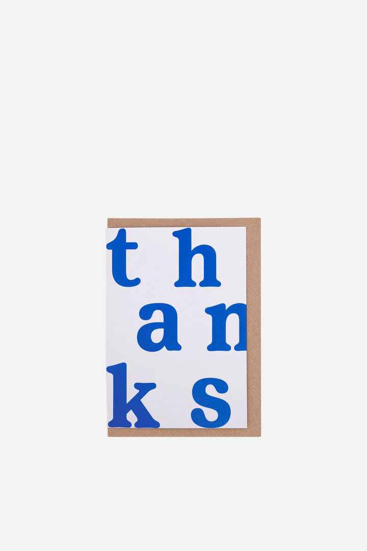 greeting card with 'thanks' in blue letters on a white background