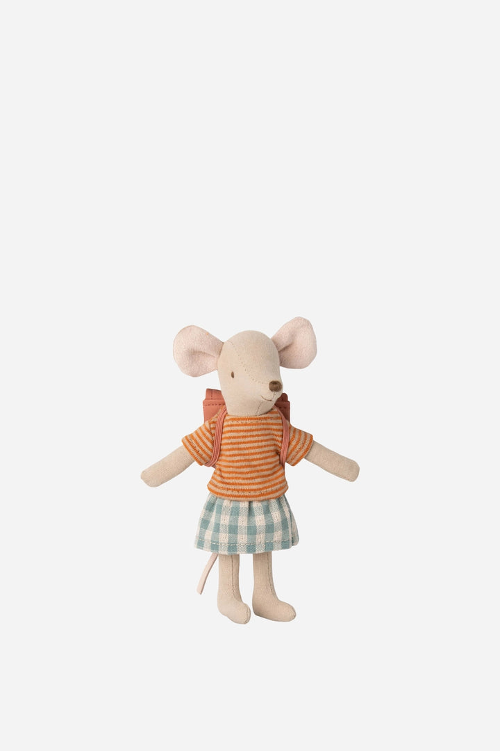 Stuffed toy mouse in a dress with a backpack on a white background