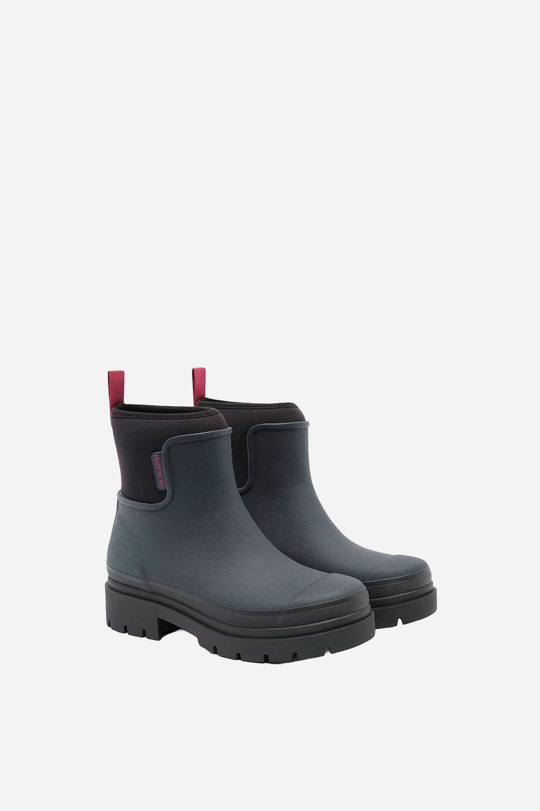 A pair of dark gray Chelsea-style rain boots with black soles and pull tabs, shown on a light gray background.