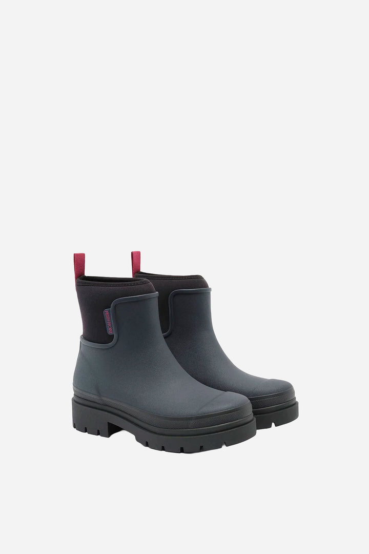 A pair of dark gray Chelsea-style rain boots with black soles and pull tabs, shown on a light gray background.
