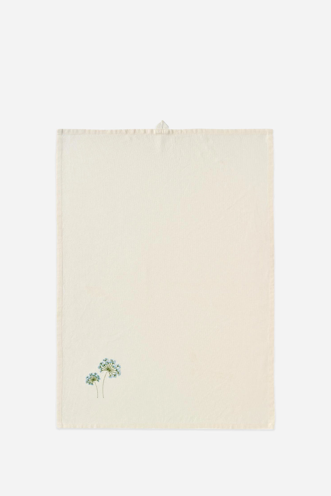 Beige towel with floral design on a white background