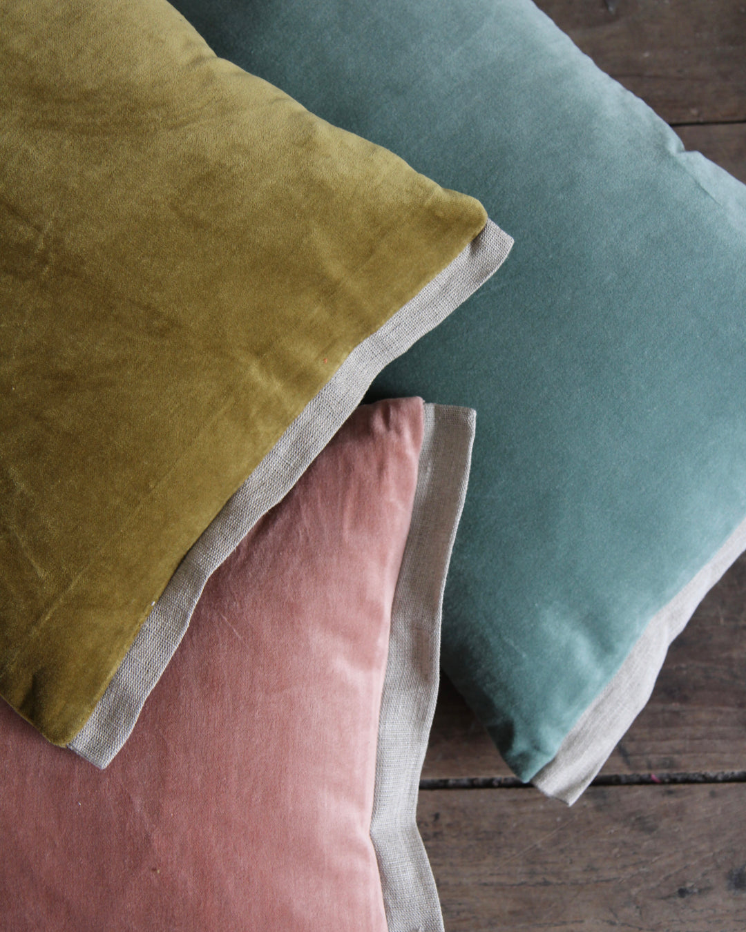 rose coloured velvet oblong cushions with natural linen trim