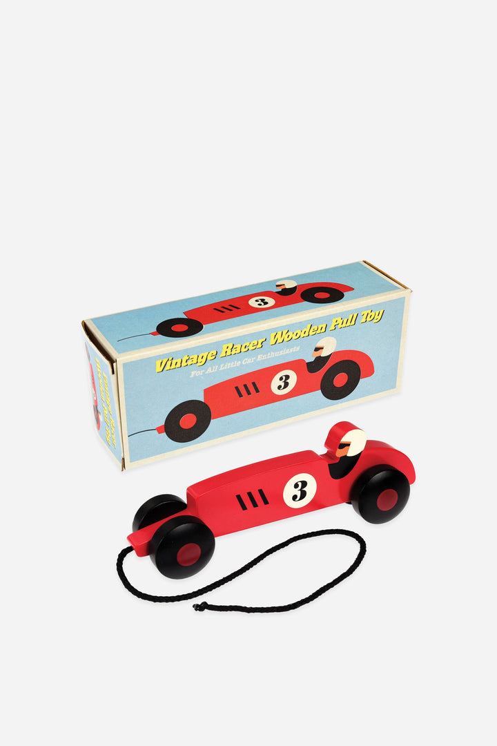 Red vintage-style wooden pull toy car with a matching box on a white background
