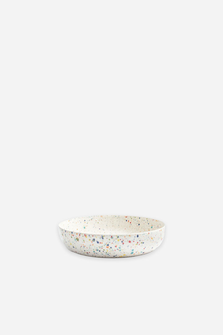 Speckled ceramic bowl on a white background