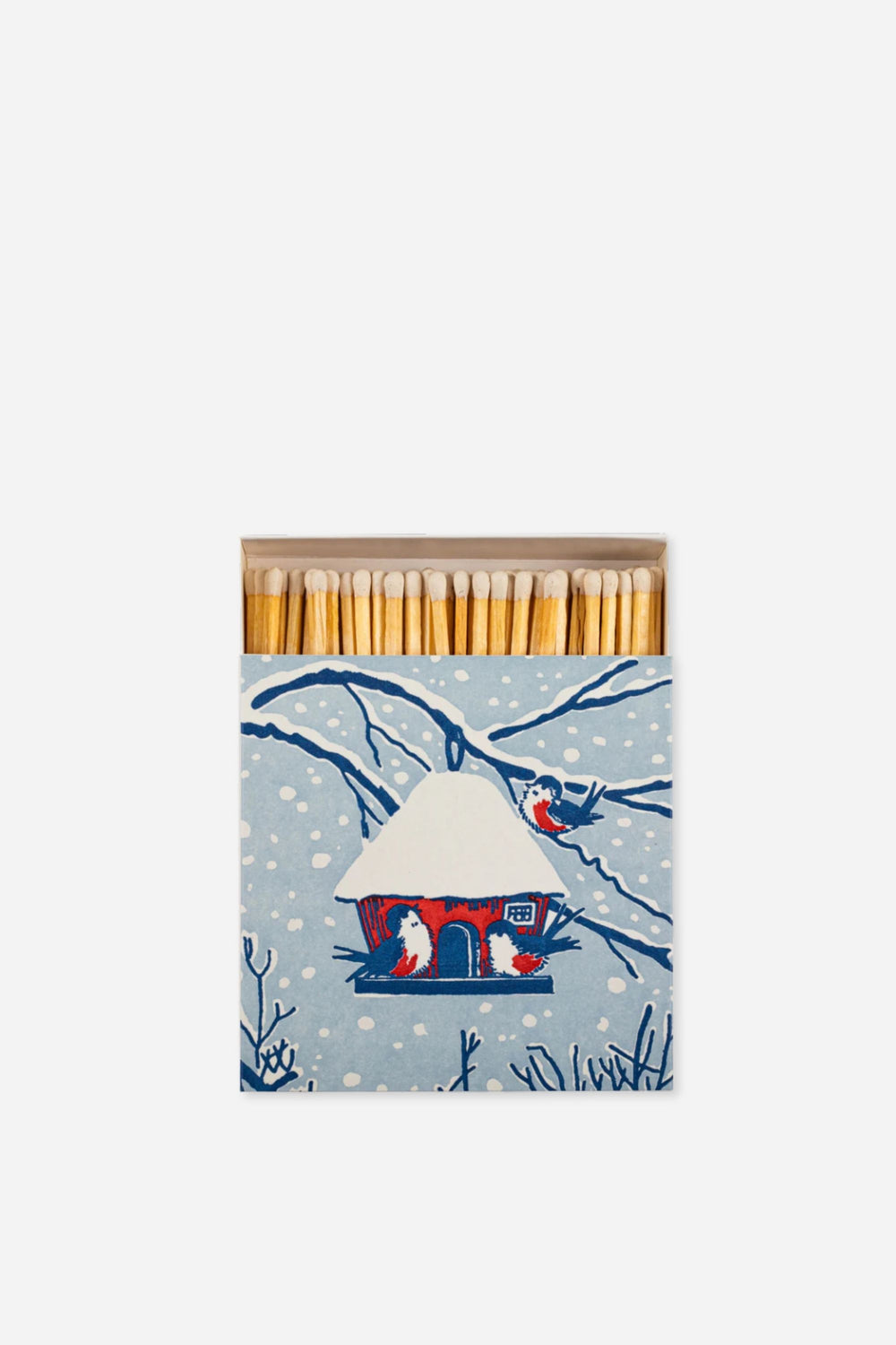 Matches in a decorative box with a winter scene design on a white background