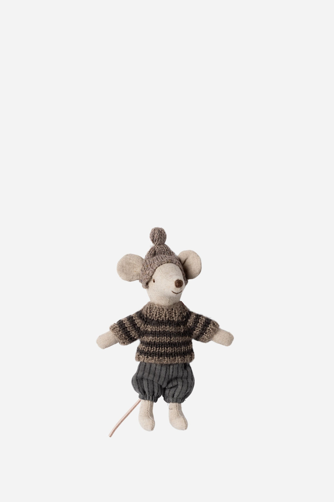 Stuffed toy mouse in a sweater and pants on a white background