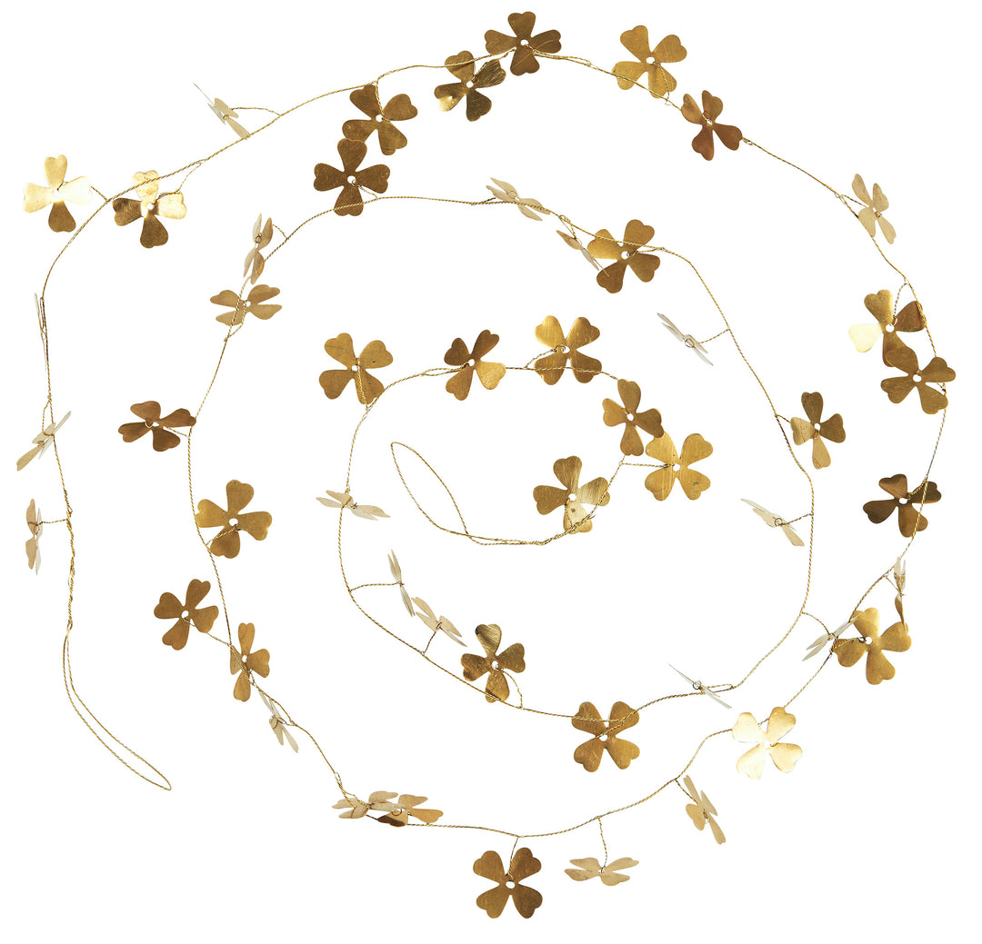 festive christmas garland made from metal wire, strung with small brass flowers