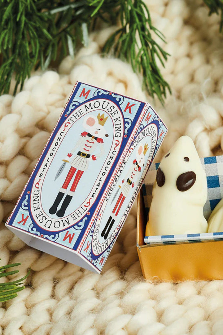 Mousetrap King packaging with a ghost toy on a textured surface with greenery