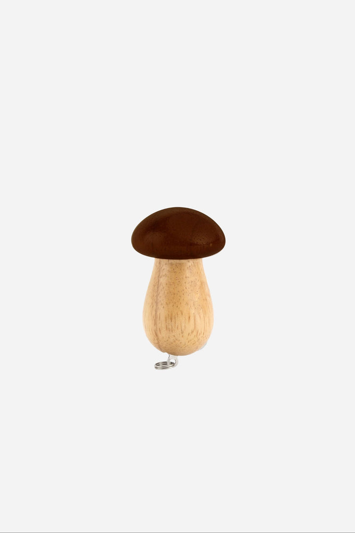 Wooden pepper grinder with brown top on a white background