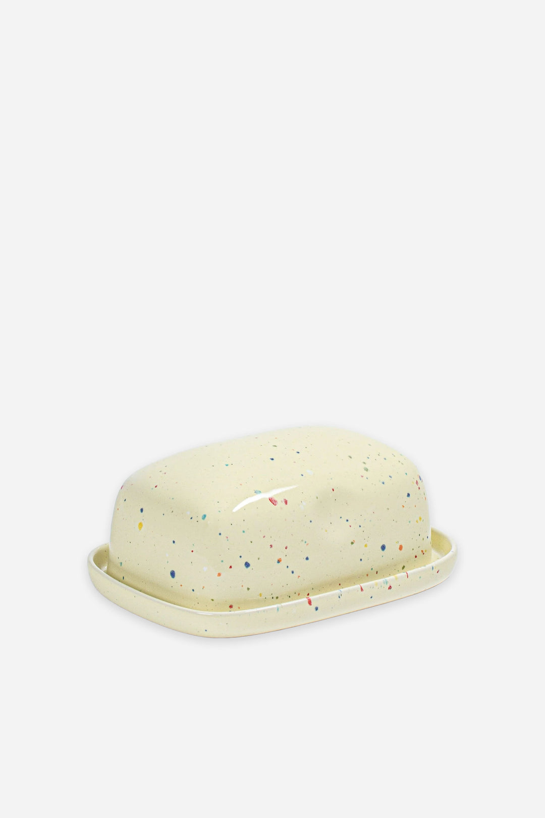Speckled butter dish on a white background