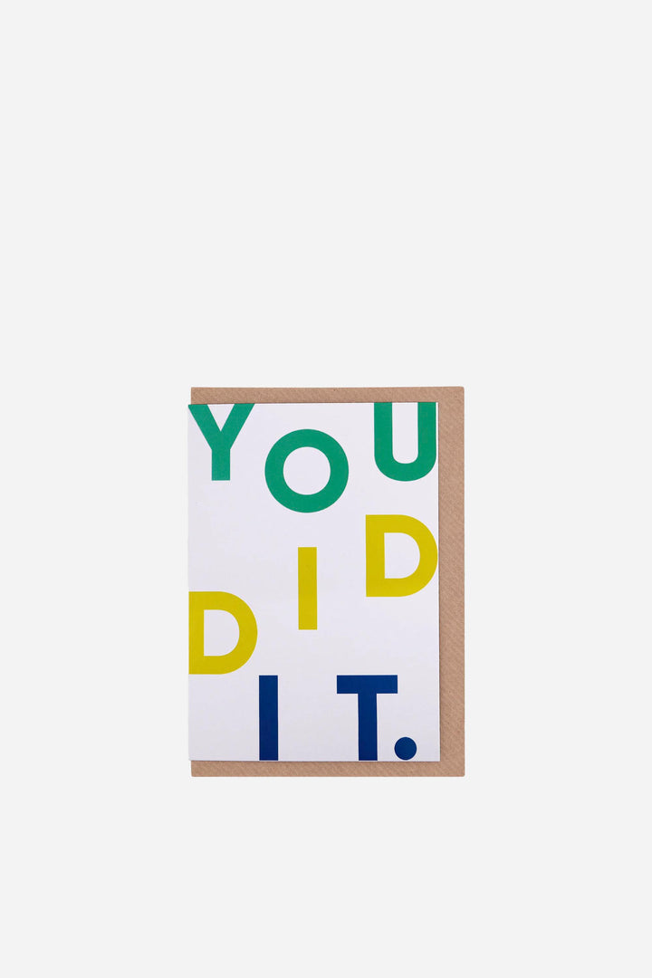 Motivational greeting card with 'YOU DID IT.' text in colourful letters on a white background